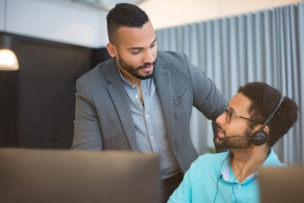 IT technician supporting a small business office, comparing MSP vs in-house IT options