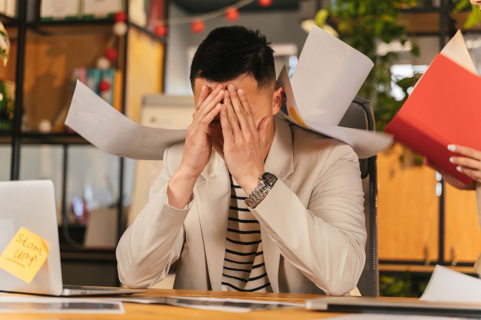 Small business owner reviewing unexpected data breach recovery costs after a hack