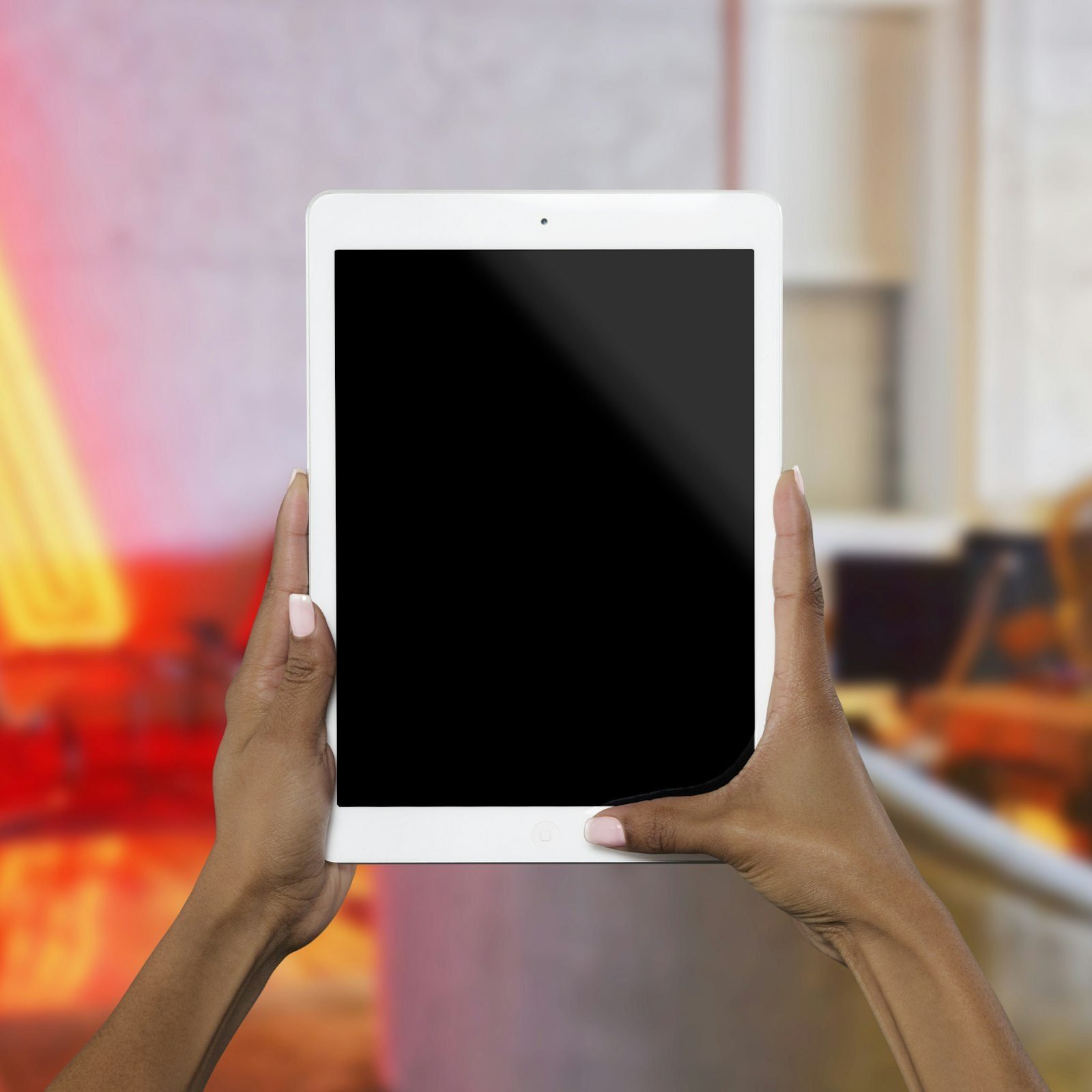 Homeowner controlling smart home lighting and security from a tablet after pre-construction technology planning