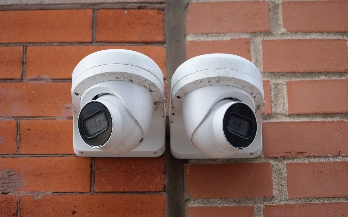 Security cameras mounted on the brick exterior of an existing home in Chattanooga